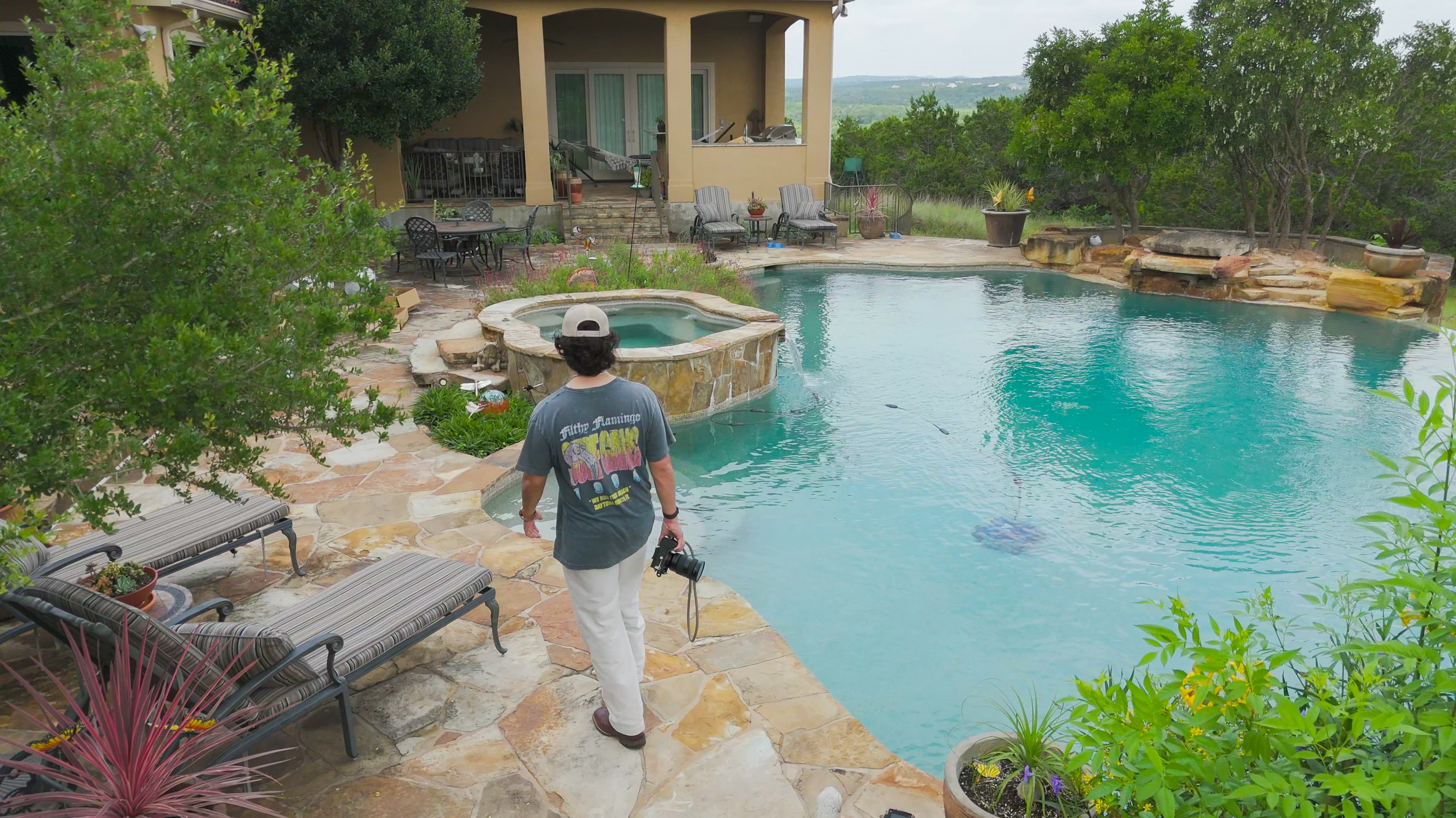 Spade Studios team reviewing aerial footage and a property marketing plan